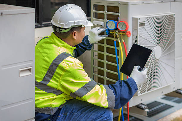 Professional Heat Pump Repair technician working in Devens, MA
